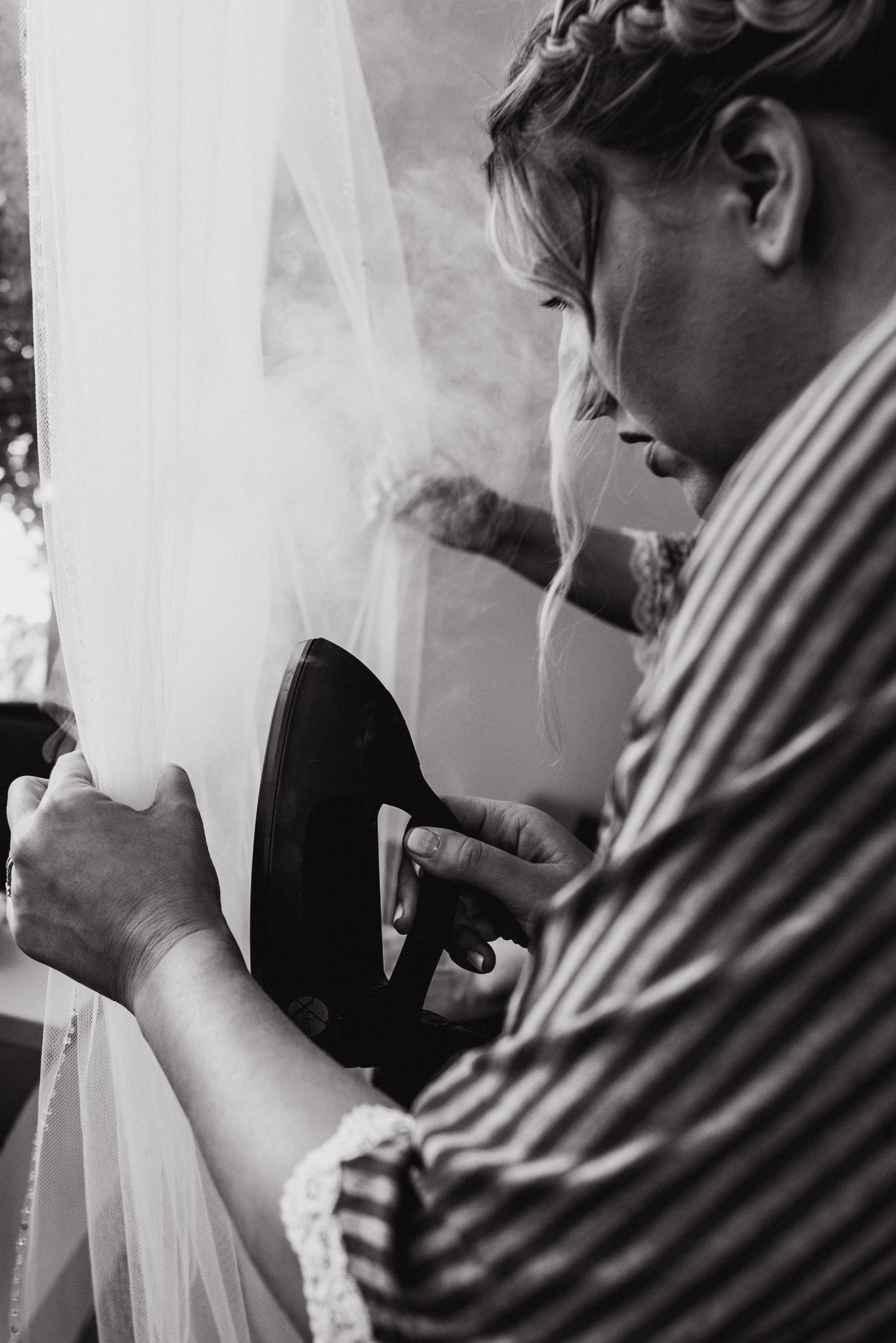 Steaming the dressat a Romantic Style San Diego Wedding at Marina Village by Kylie Rae Photography