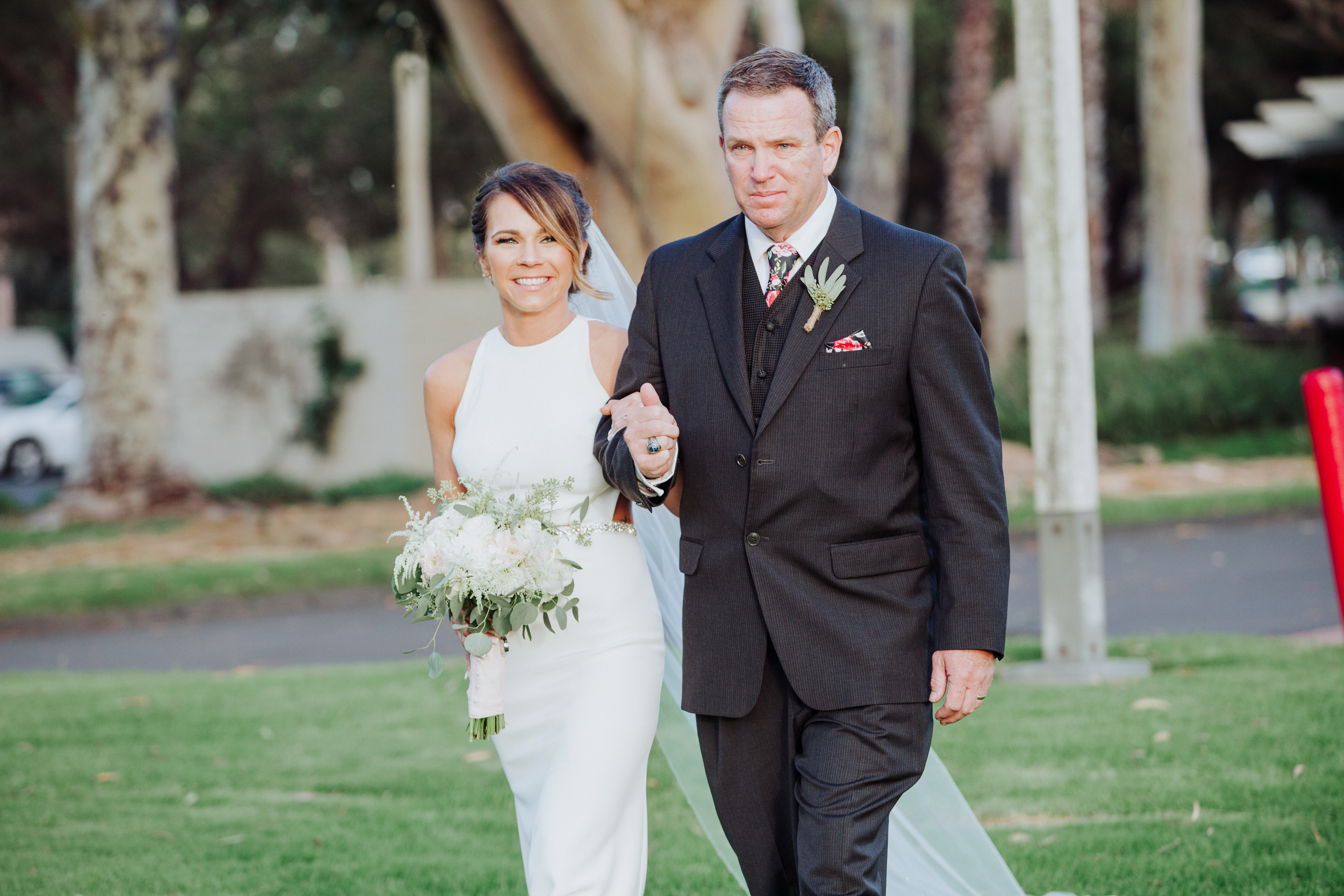 Bride walking with fatherat a Romantic Style San Diego Wedding at Marina Village by Kylie Rae Photography
