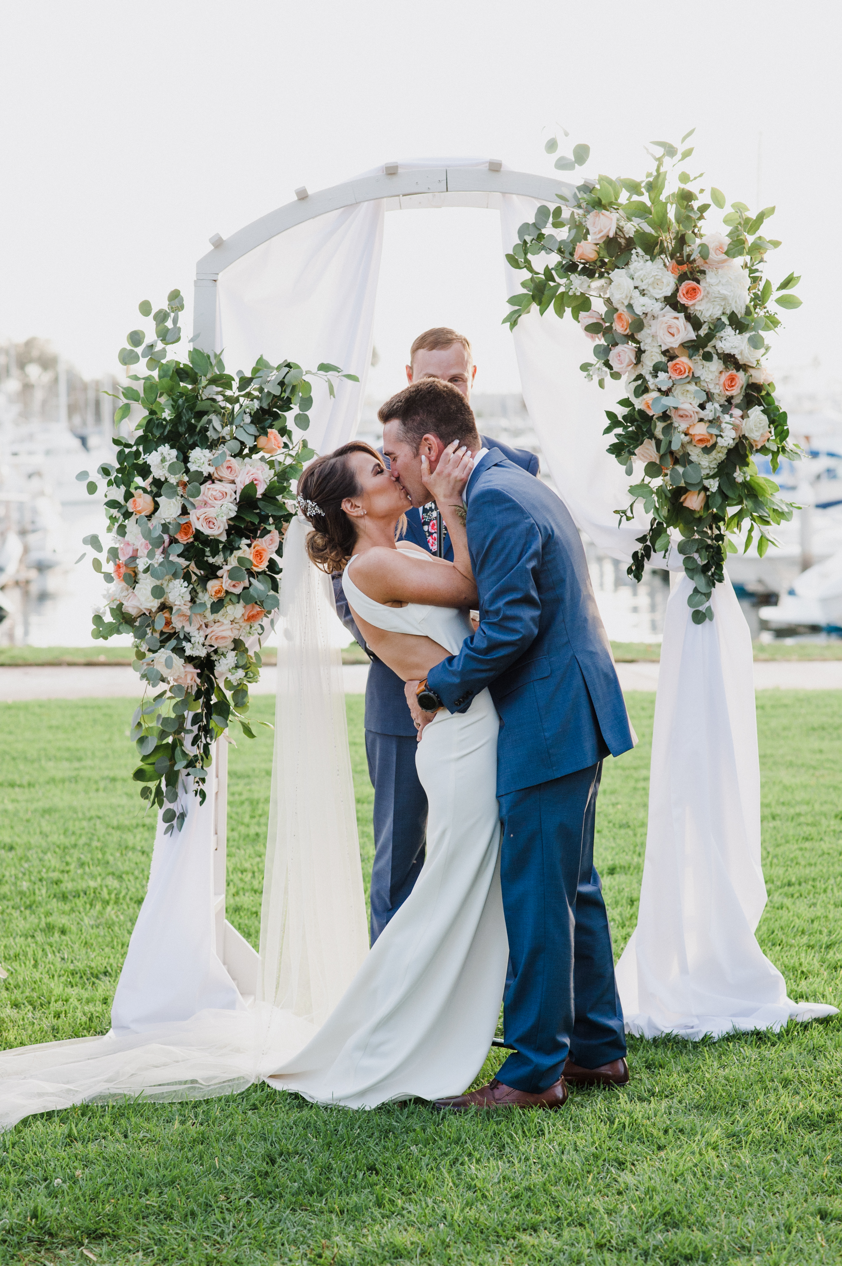 First kiss as husband and wifeat a Romantic Style San Diego Wedding at Marina Village by Kylie Rae Photography