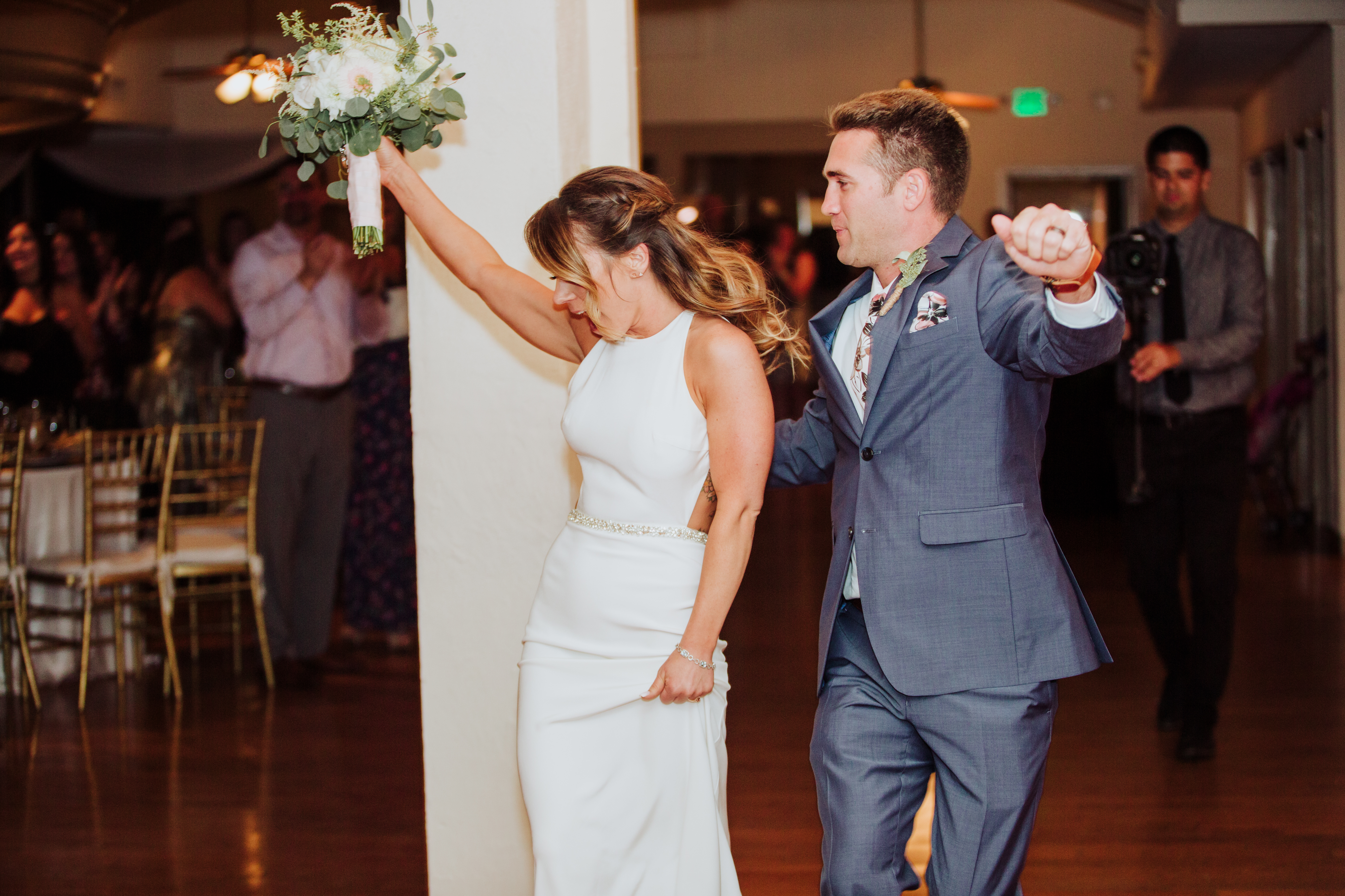Bride and groom grand entranceat a Romantic Style San Diego Wedding at Marina Village by Kylie Rae Photography