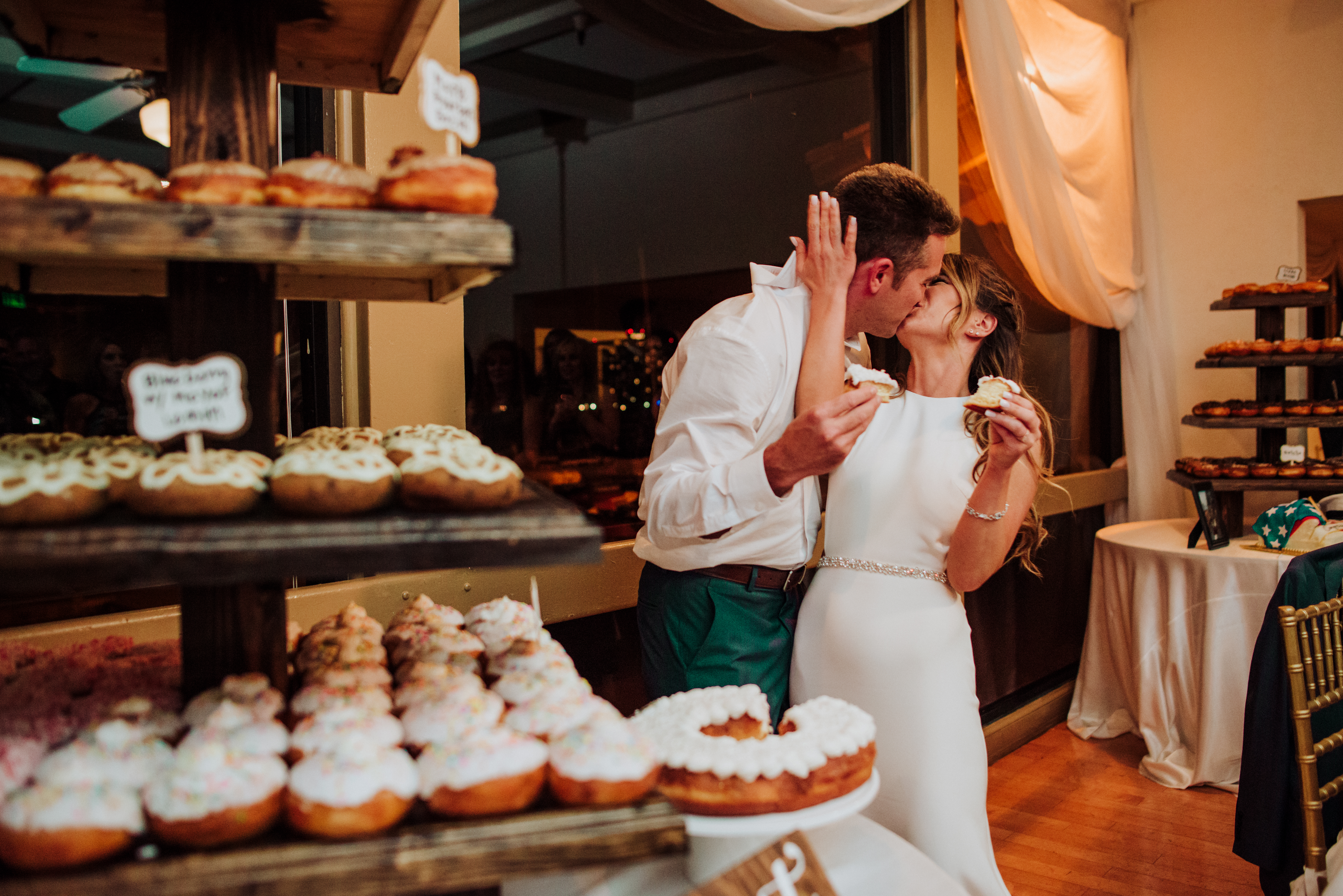 Bride and groom cutting cakeat a Romantic Style San Diego Wedding at Marina Village by Kylie Rae Photography