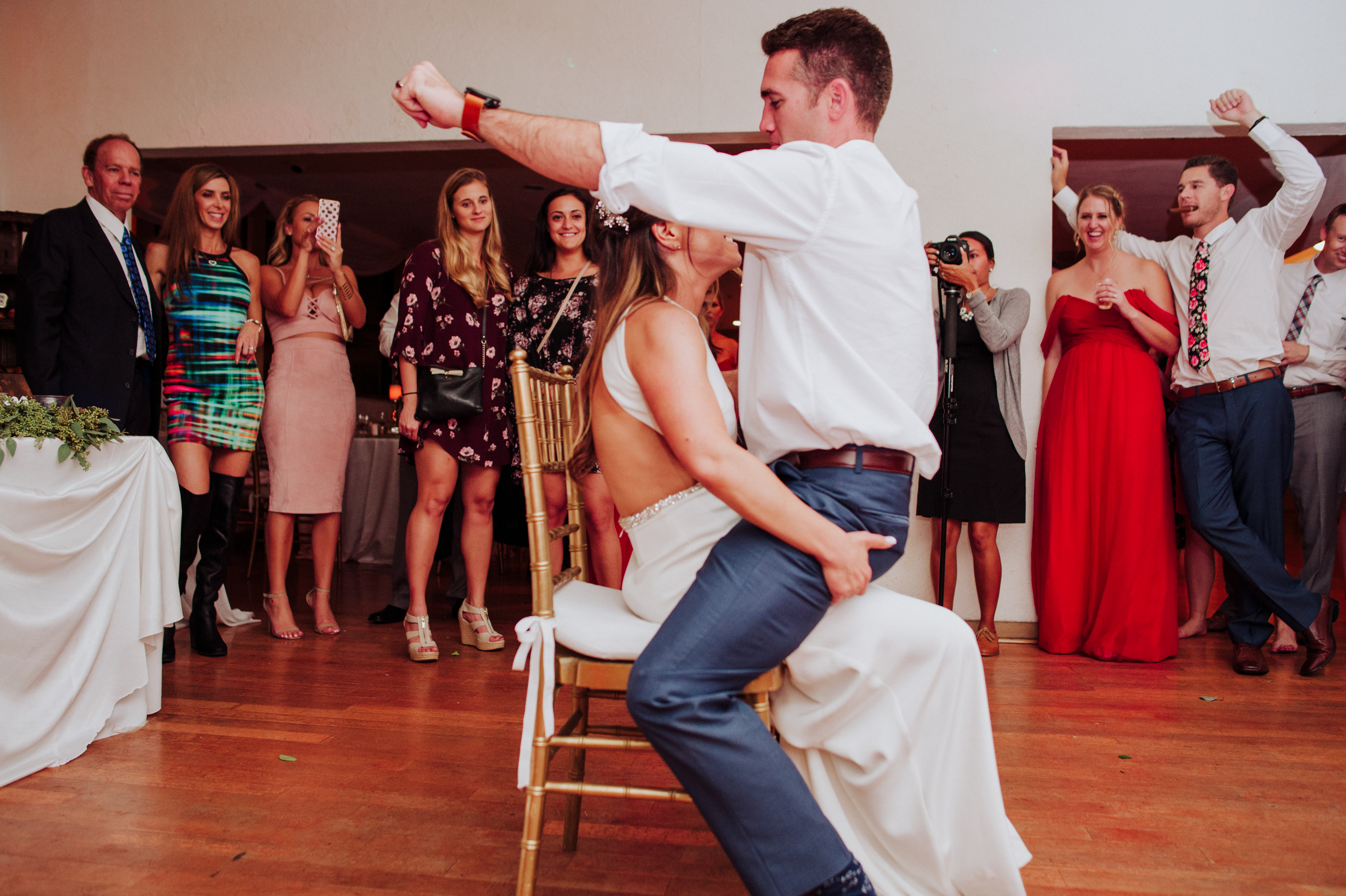Groom giving his bride a lap danceat a Romantic Style San Diego Wedding at Marina Village by Kylie Rae Photography