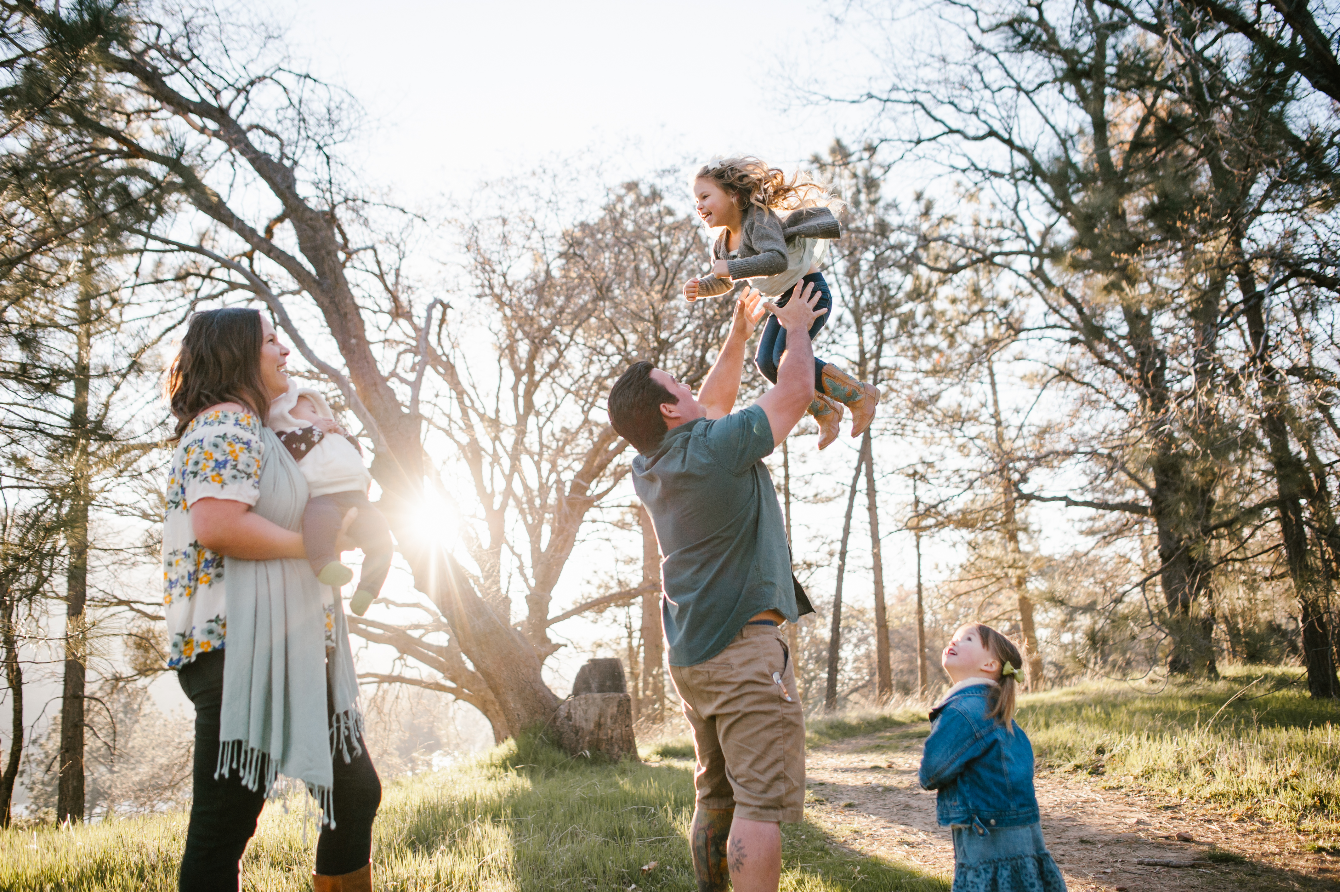 Dad throwing daughterat a Family Session at Lake Cuyamaca by Kylie Rae Photography