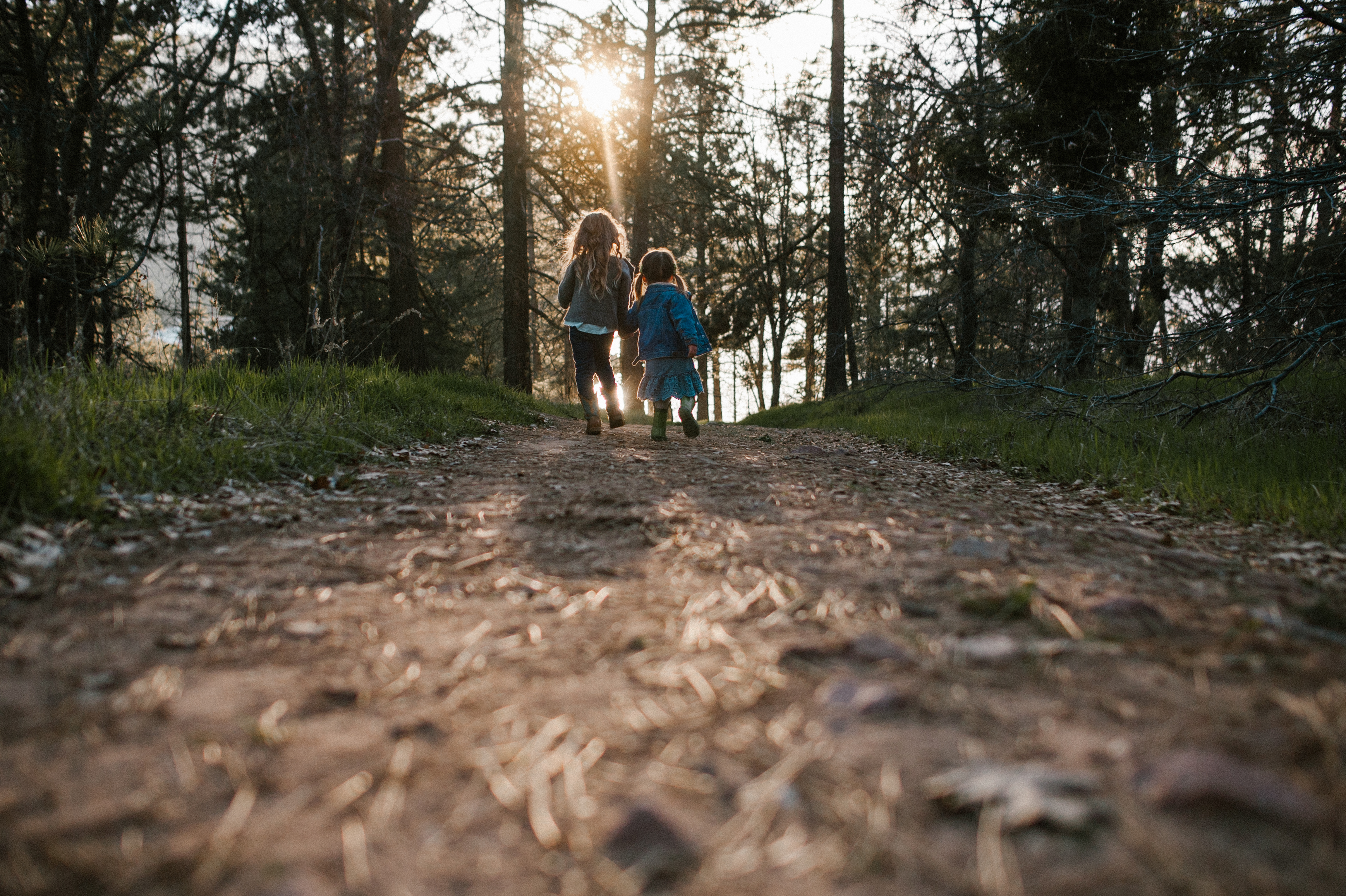 Sisters holding handsat a Family Session at Lake Cuyamaca by Kylie Rae Photography