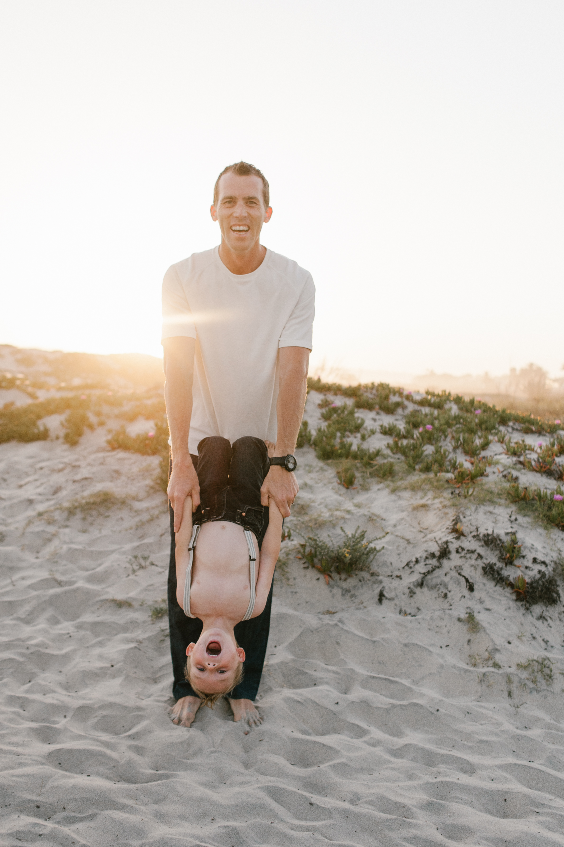 Father playing with sonfamily session at Coronado Beach by Kylie Rae Photography