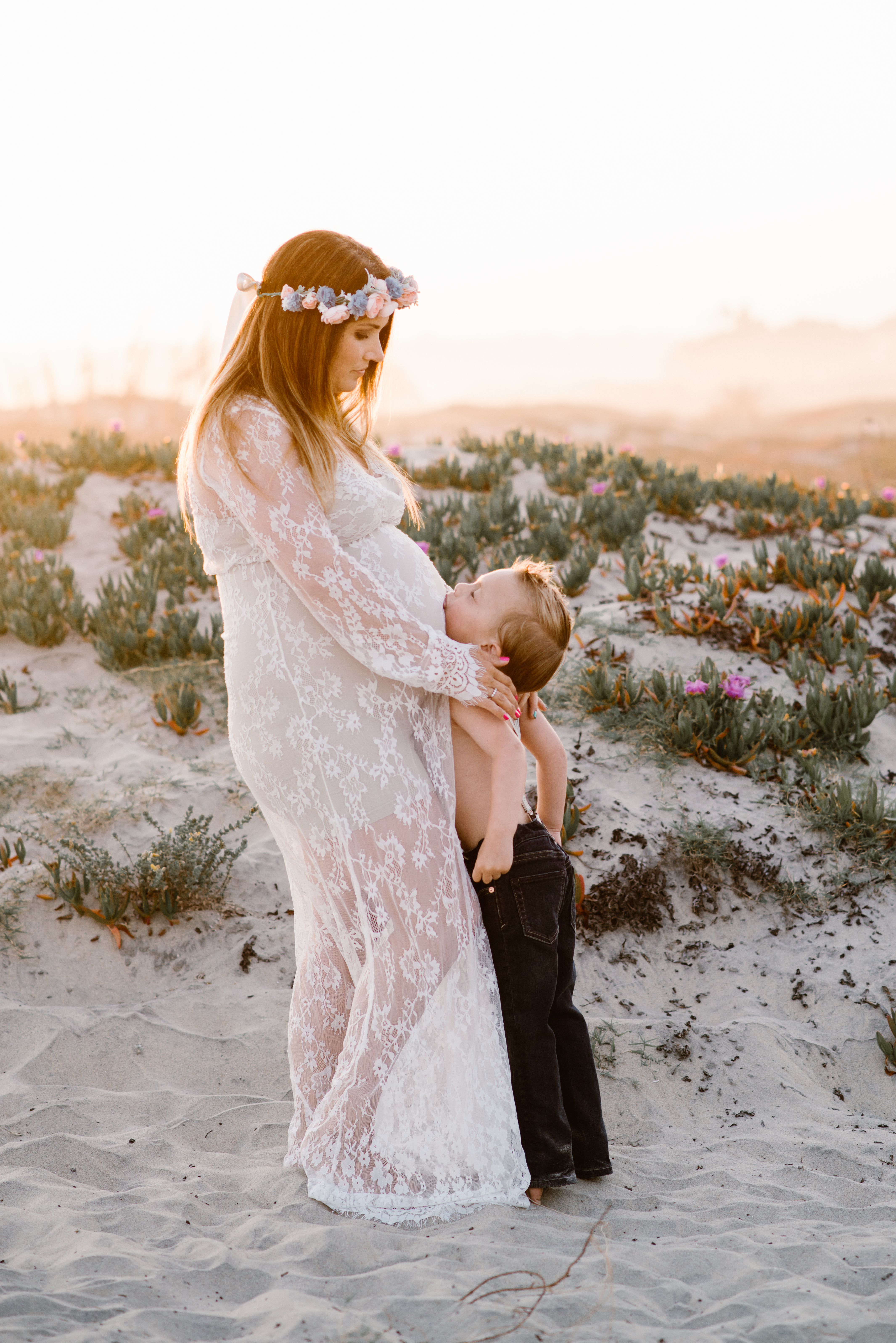 Son kissing bellyfamily session at Coronado Beach by Kylie Rae Photography