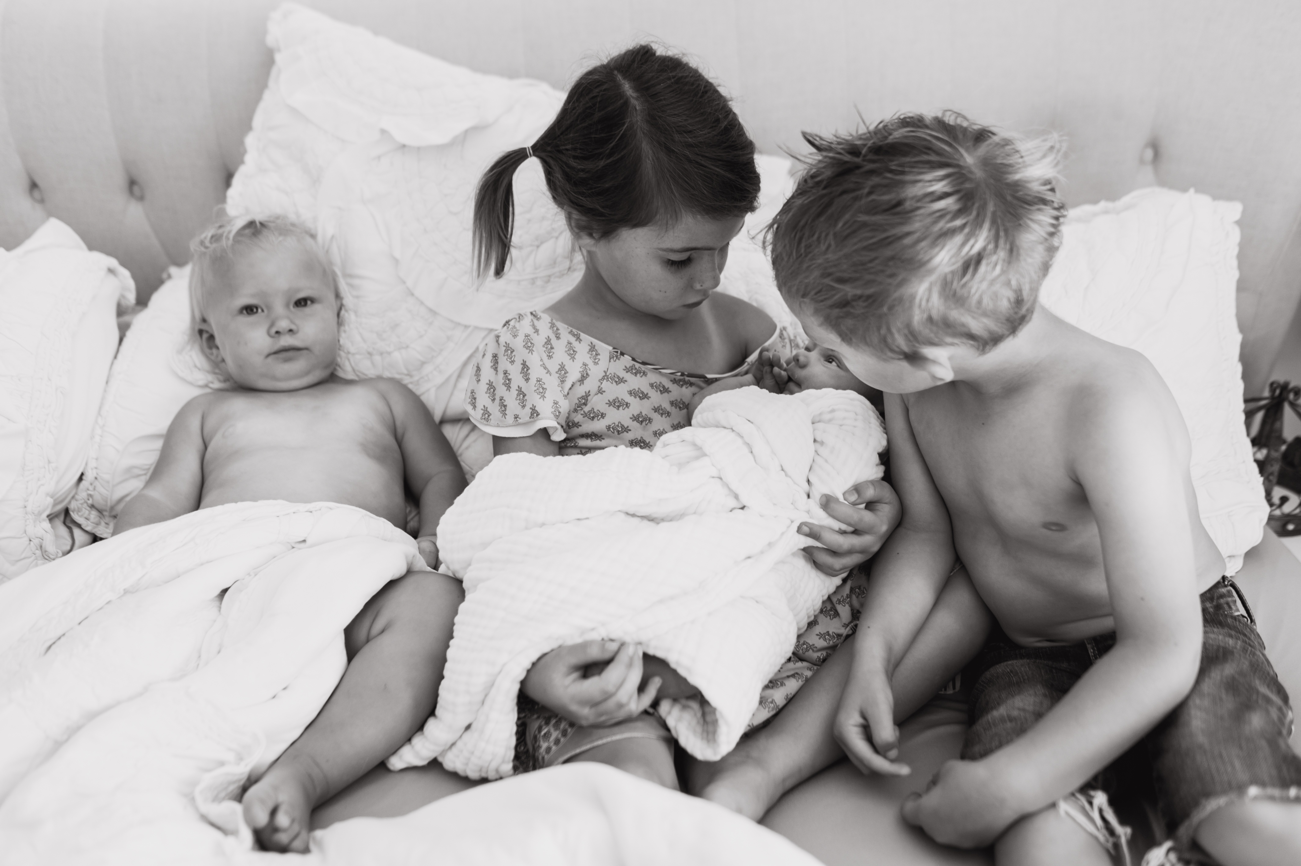 Siblings meeting newbornLifestyle In Home Family Session by Kylie Rae Photography