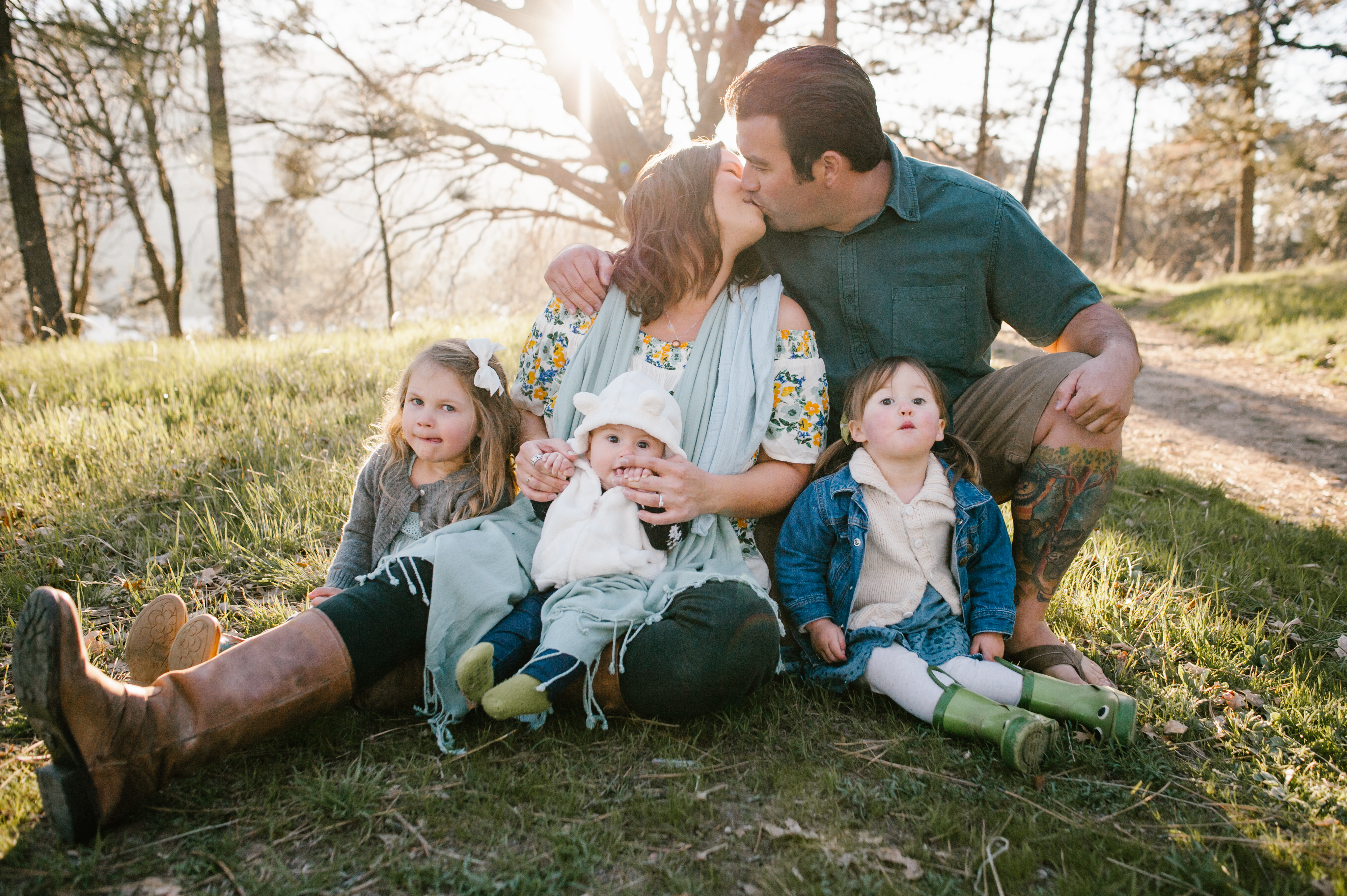 Mom and Dad Kissingat a Family Session at Lake Cuyamaca by Kylie Rae Photography